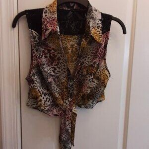 Sleeveless, button up, tie in front, pockets, black onyx buttons and lace blouse